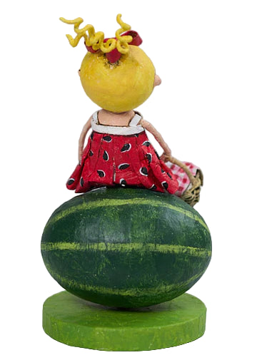 Decorative figure on a watermelon base with a blurred background