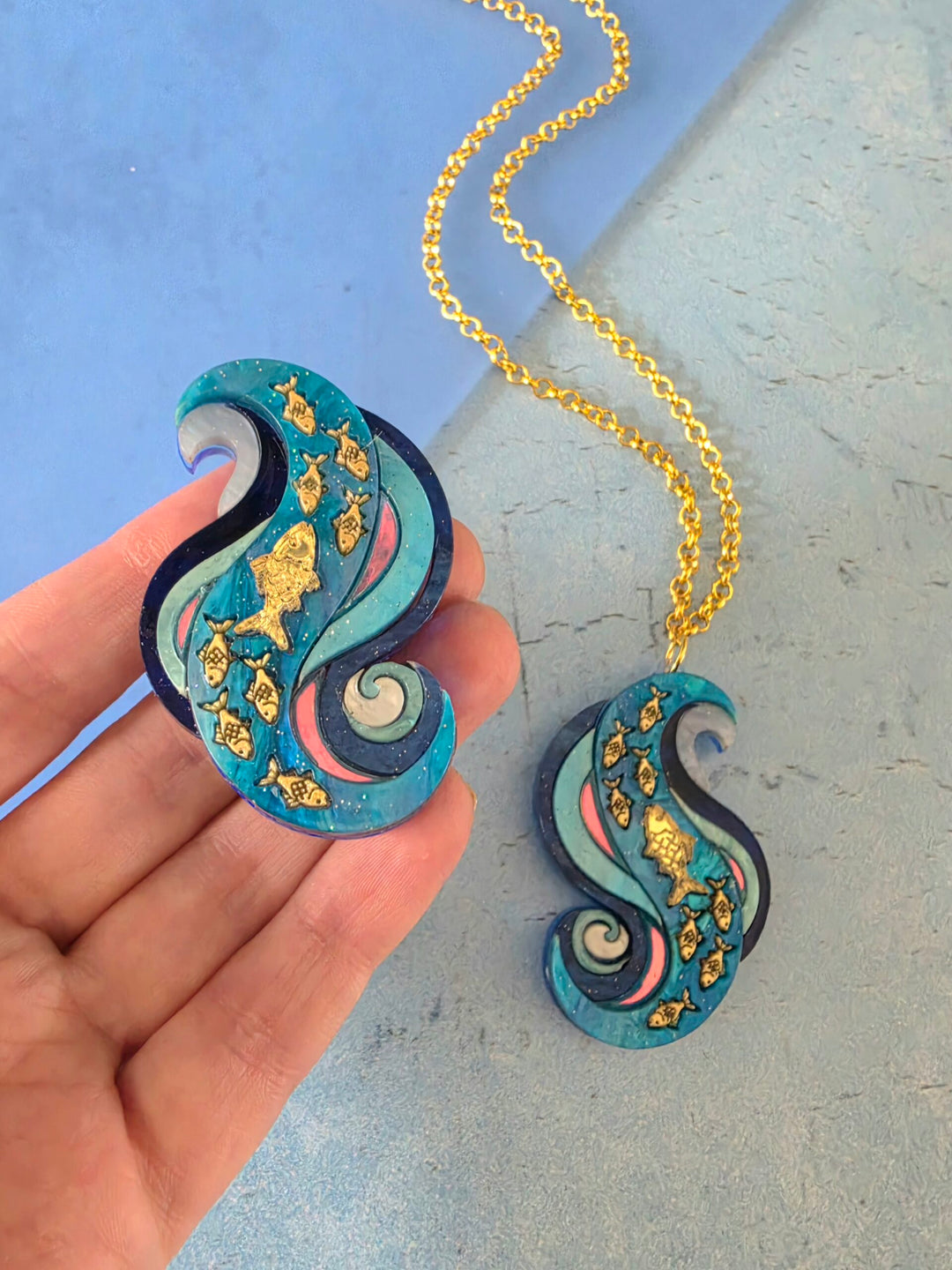 Swimming Against the Current Shoal of Fish Pin or Pendant