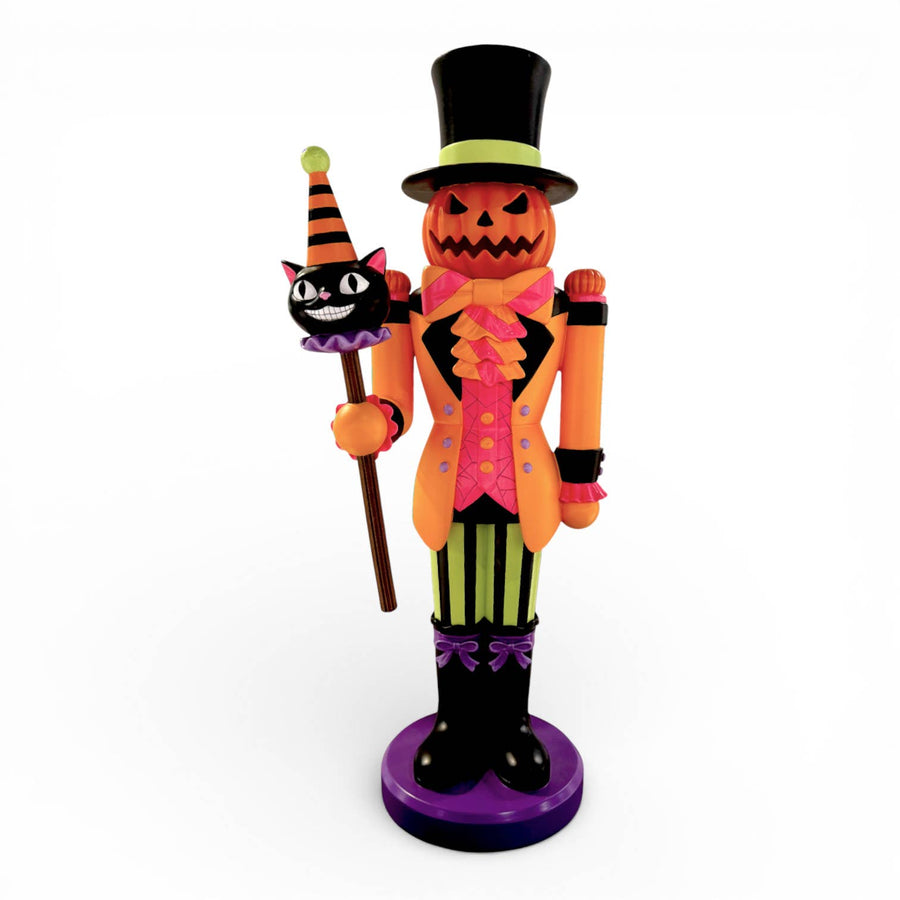 21 inch pumpkin headed nutcracker figure holding a black cat staff