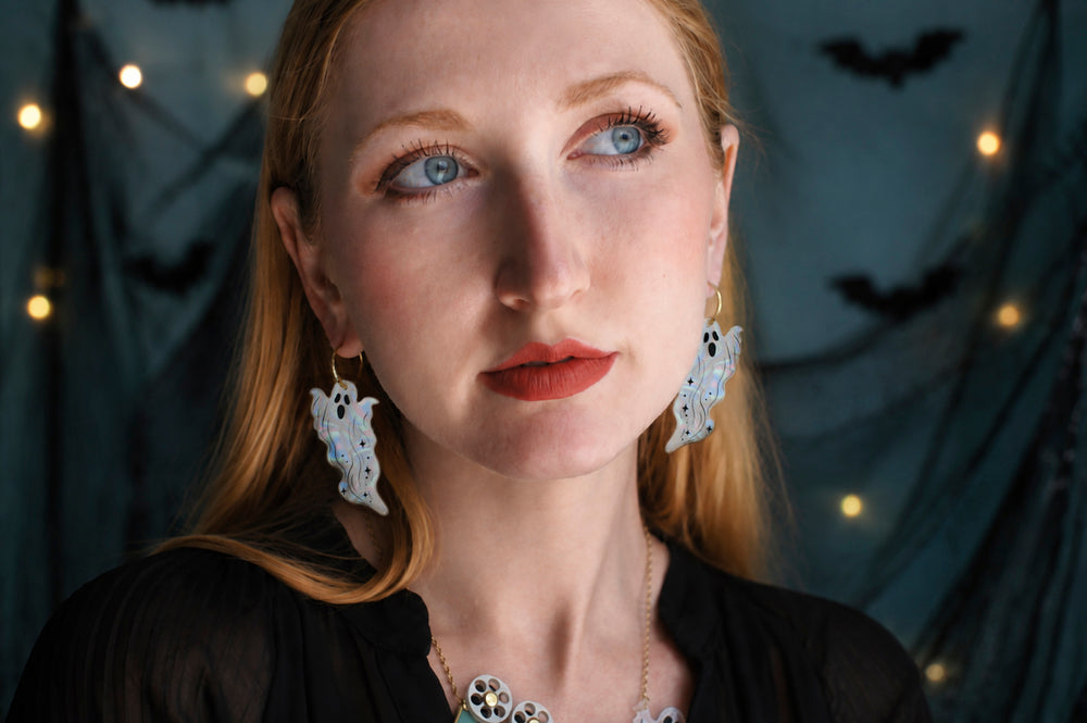 Long ghost drop earrings detail — pearlescent acrylic Halloween statement jewelry — LaliBlue Midnight Cinema