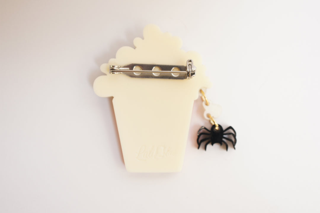Layered acrylic Halloween popcorn brooch set worn — spooky cinema snack jewelry — LaliBlue Midnight Cinema