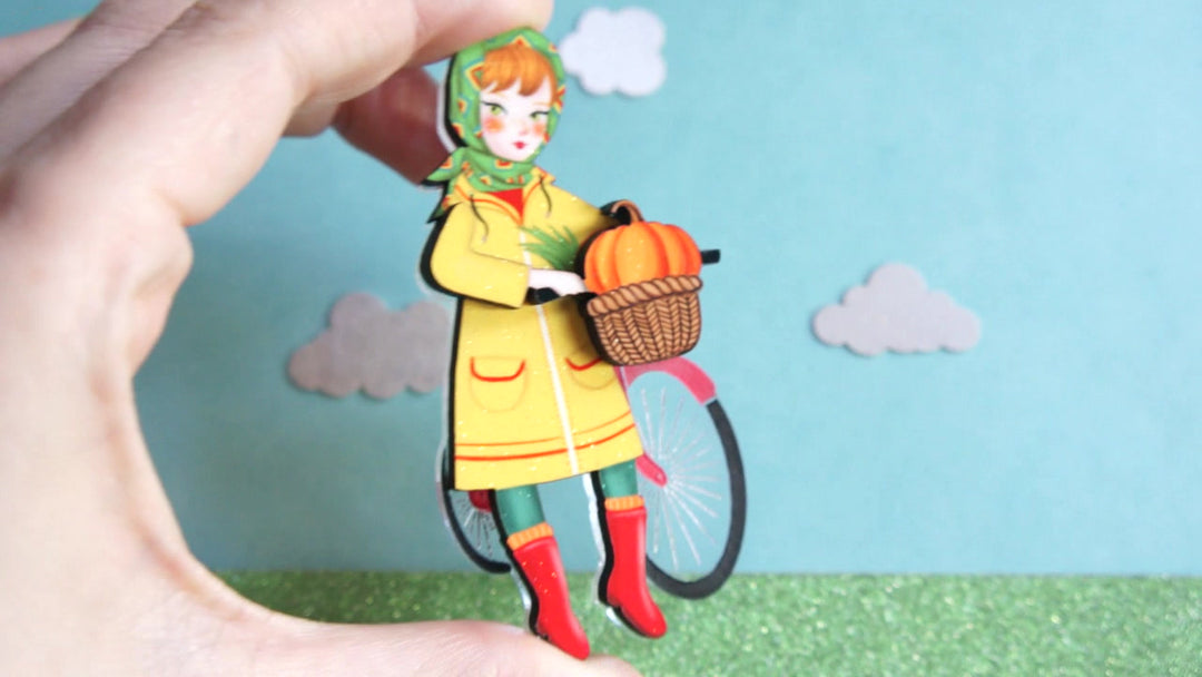 Girl with bicycle brooch by Laliblue