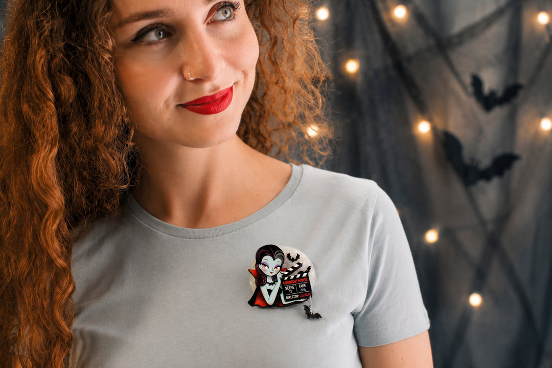 Vampire clapperboard brooch close-up — layered acrylic Halloween cinema jewelry — LaliBlue Midnight Cinema