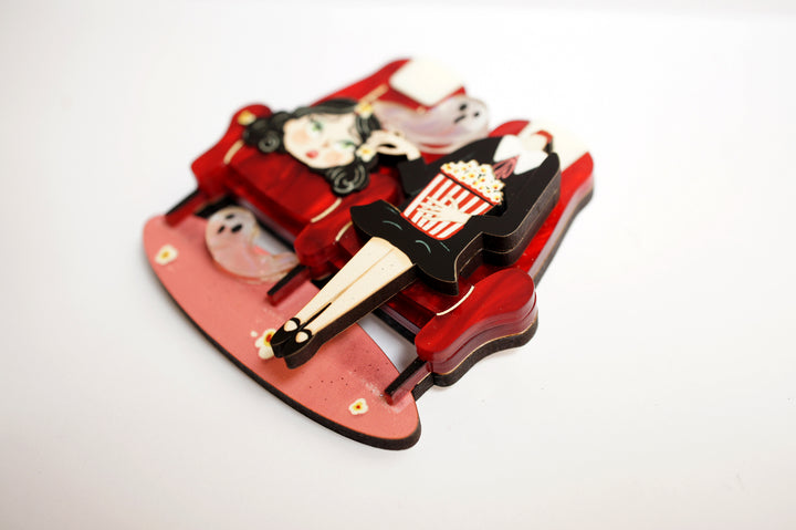 Headless cinema viewer brooch close-up — Halloween movie audience acrylic illustrated wood jewelry — LaliBlue Midnight Cinema