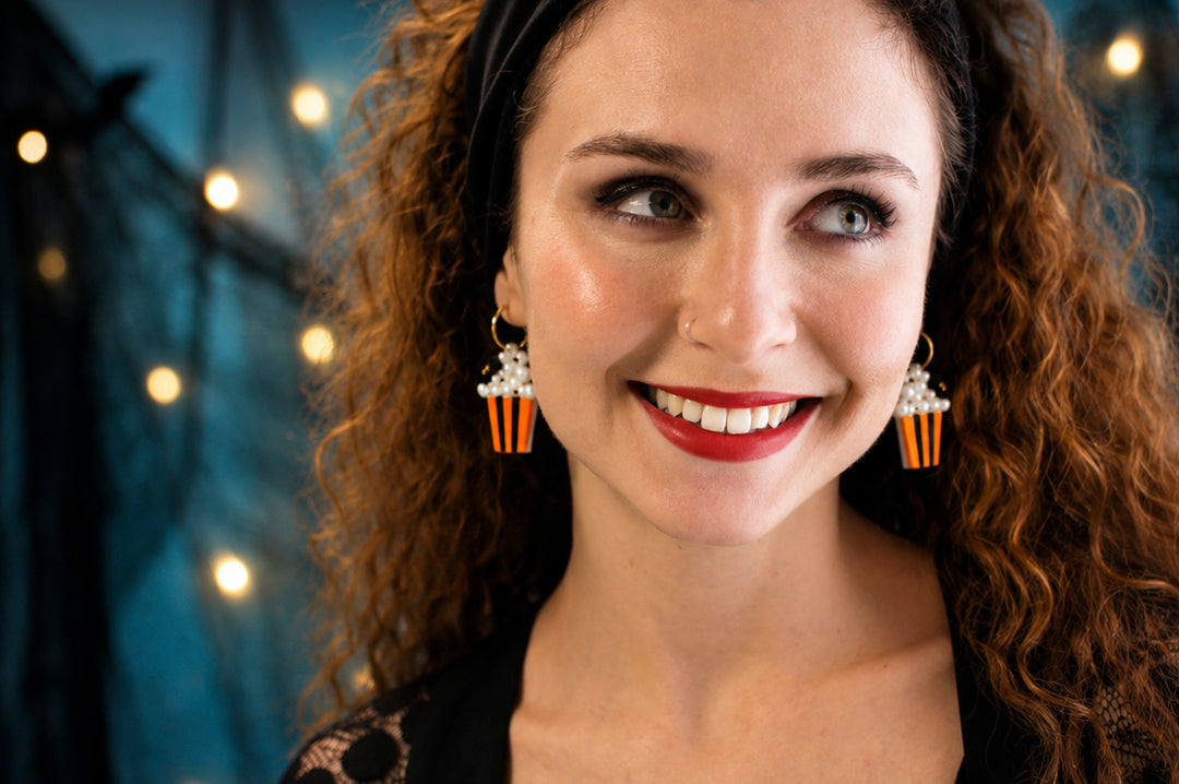 Halloween popcorn bucket and spider earrings detail — acrylic novelty cinema jewelry — LaliBlue Midnight Cinema