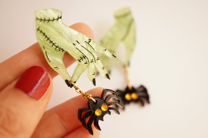 Zombie hands and spider earrings worn — acrylic horror statement jewelry — LaliBlue Midnight Cinema
