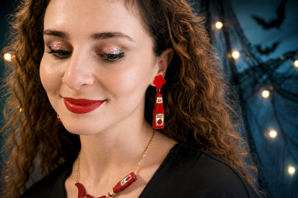 Ketchup blood bottle earrings detail — horror movie novelty acrylic jewelry — LaliBlue Midnight Cinema
