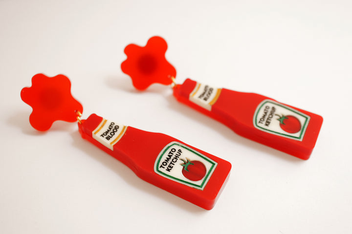 Ketchup blood bottle earrings worn — horror movie novelty acrylic jewelry — LaliBlue Midnight Cinema
