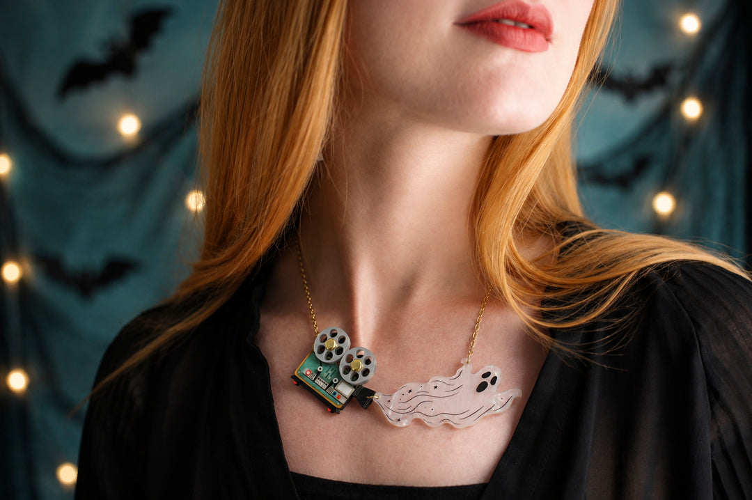 Ghost film projector necklace detail — articulated Halloween cinema acrylic jewelry — LaliBlue Midnight Cinema