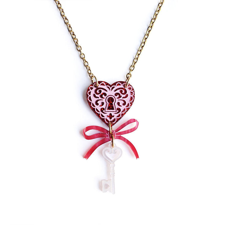 Necklace with heart-shaped lock and key pendant on a white background