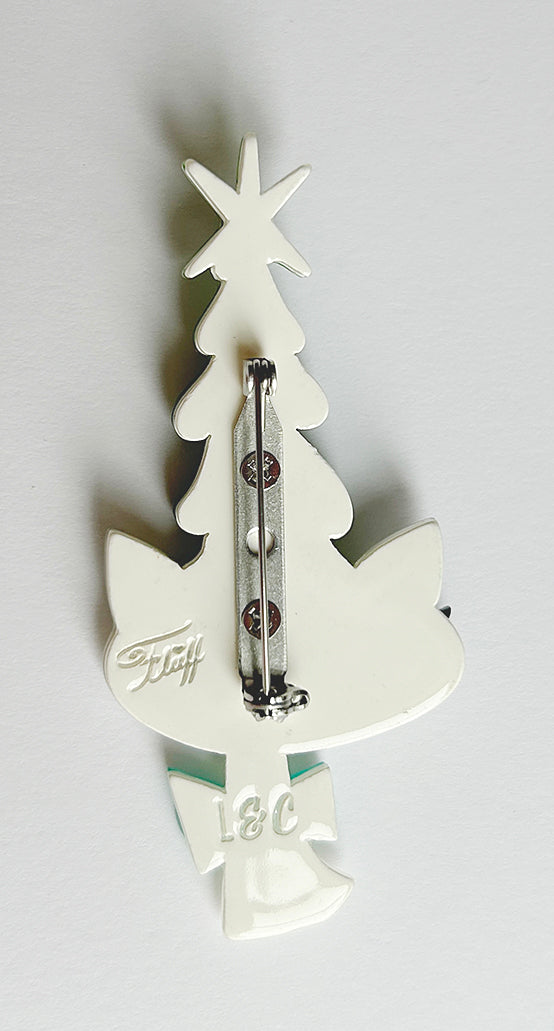 Photo featuring the locking clasp of the Christmas Kitty brooch by Miss Fluff and Lipstick and Chrome. Holiday Christmas tree hat on a cat.