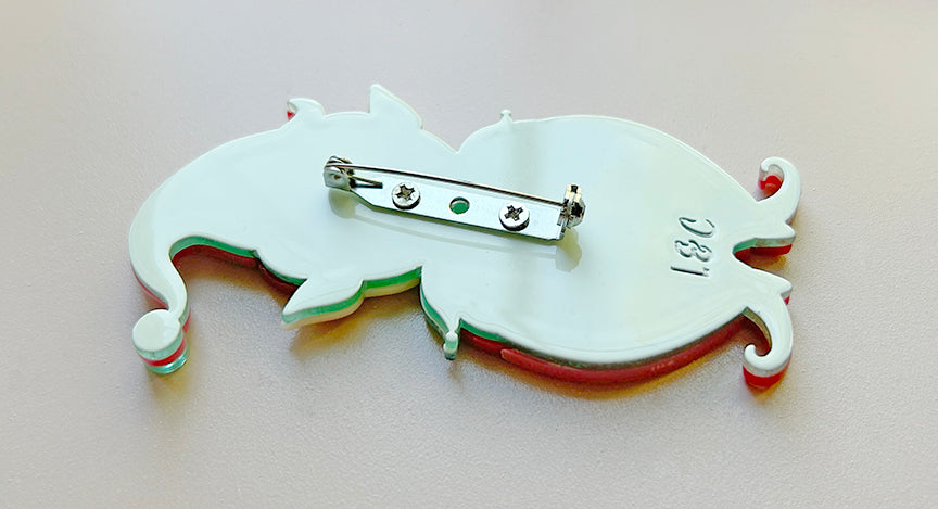 Back of the PINK North Pole Apprentice brooch by Johanna Parker and Lipstick and Chrome. Christmas holiday elf pin.