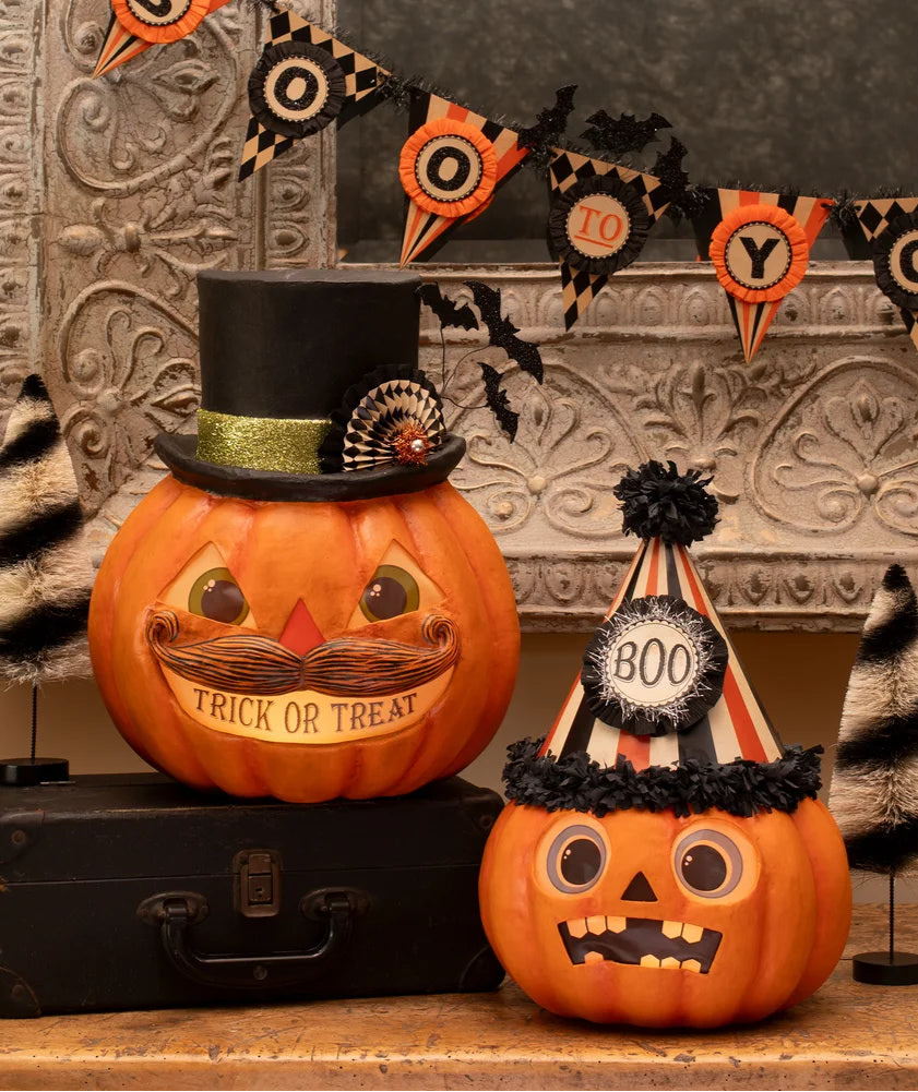 Halloween-themed pumpkins with decorative hats and a banner on a rustic background Bethany lowe johanna parker vintage halloween