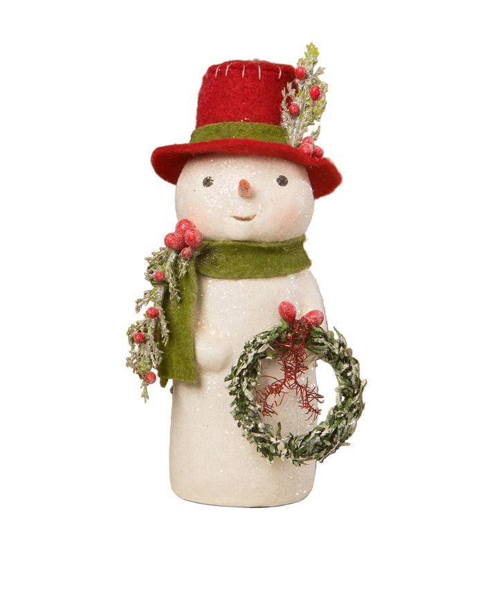 Decorative snowman figurine with a red hat, green scarf, and wreath oby Behany Lowe.