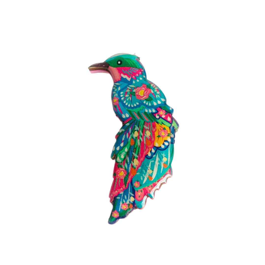 'The beautiful illustrated bird brooch' A beautiful illustrated bird brooch for your summer outfits or to perch perfectly on any jacket. Created in colourful detail with a baby pink acrylic back and stainless steel pin. Stunningly vibrant and to make you feel just incredible. Makes such a wonderful gift for bird lovers too! Brooch basics * Measurements 5cm 3cm * Baby pink acrylic backing with Rosie Rose Parker logo. * Beautiful bird theme made from an original illustration. * Laser cut wood with glass resin