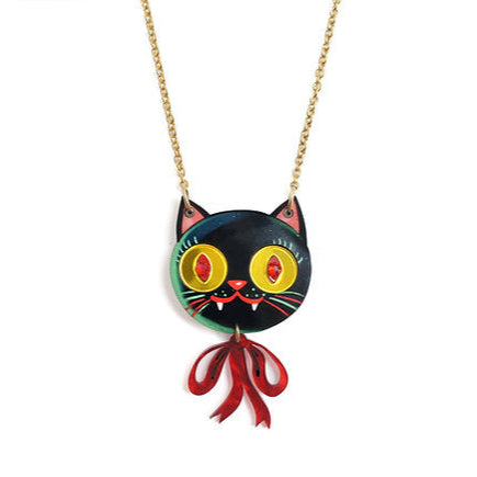 Cat-shaped pendant necklace with a red bow on a white background