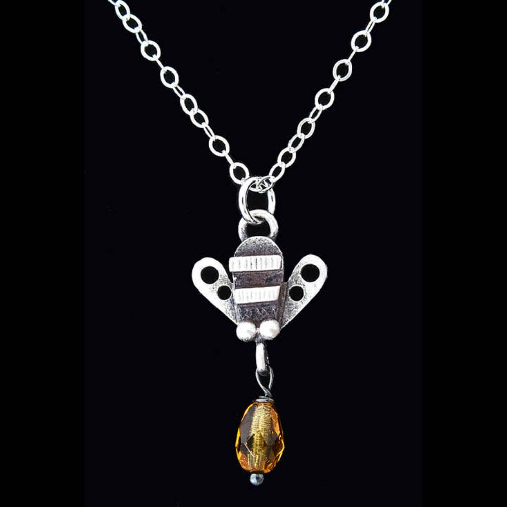 Chickenscratch Honey Bee Necklace detail — artisan sterling silver bee pendant with glass honey drop handmade in USA