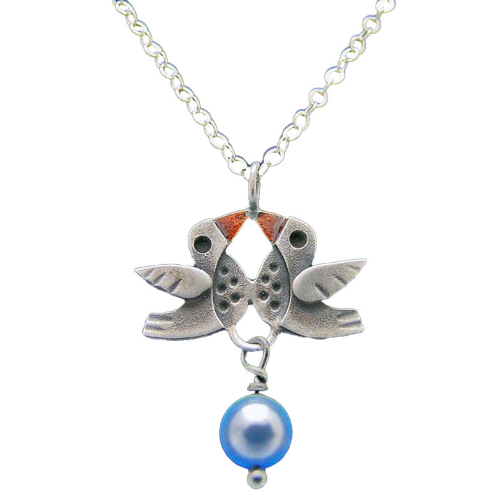 Chickenscratch Lovebirds Necklace — cast sterling silver double bird charm necklace with orange enamel accents and blue glass pearl dangle on 18-inch sterling silver chain