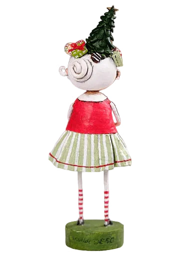 Decorative figurine of a girl with a Christmas tree on her head against a neutral background