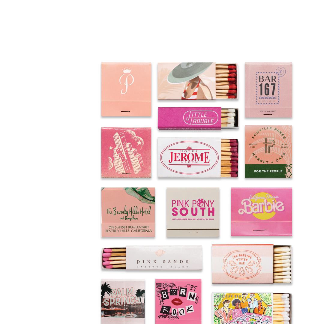Collection of pink matchboxes with various designs and text on a white background