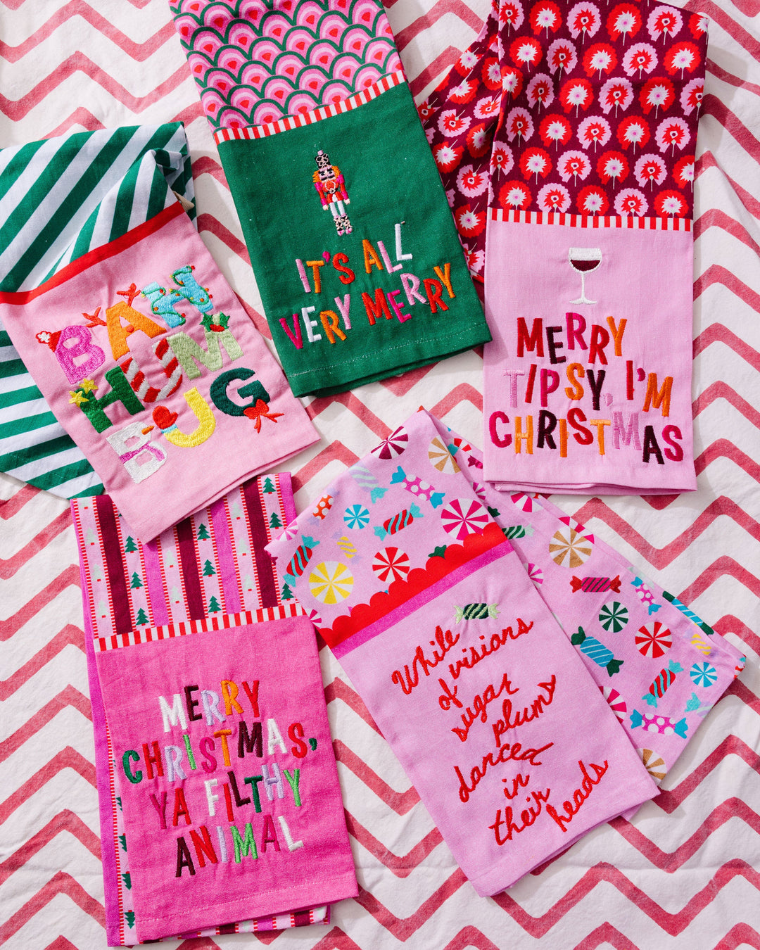 Collection of colorful pink Christmas-themed towels