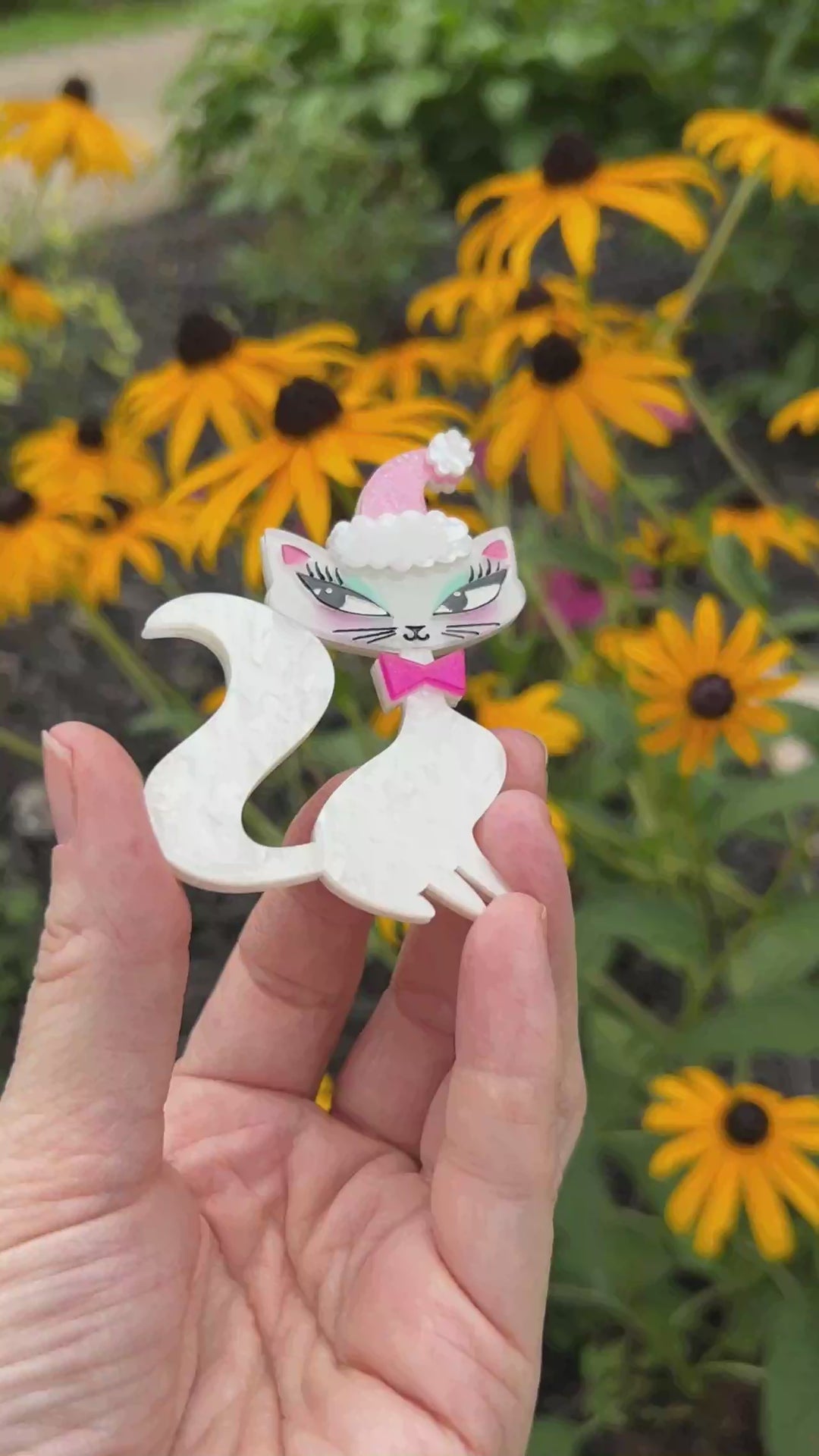 Video highlighting the Swanky Pinkmas Kitty Christmas Brooch by Miss Fluff and Lipstick and Chrome. Holiday Cat Pin.