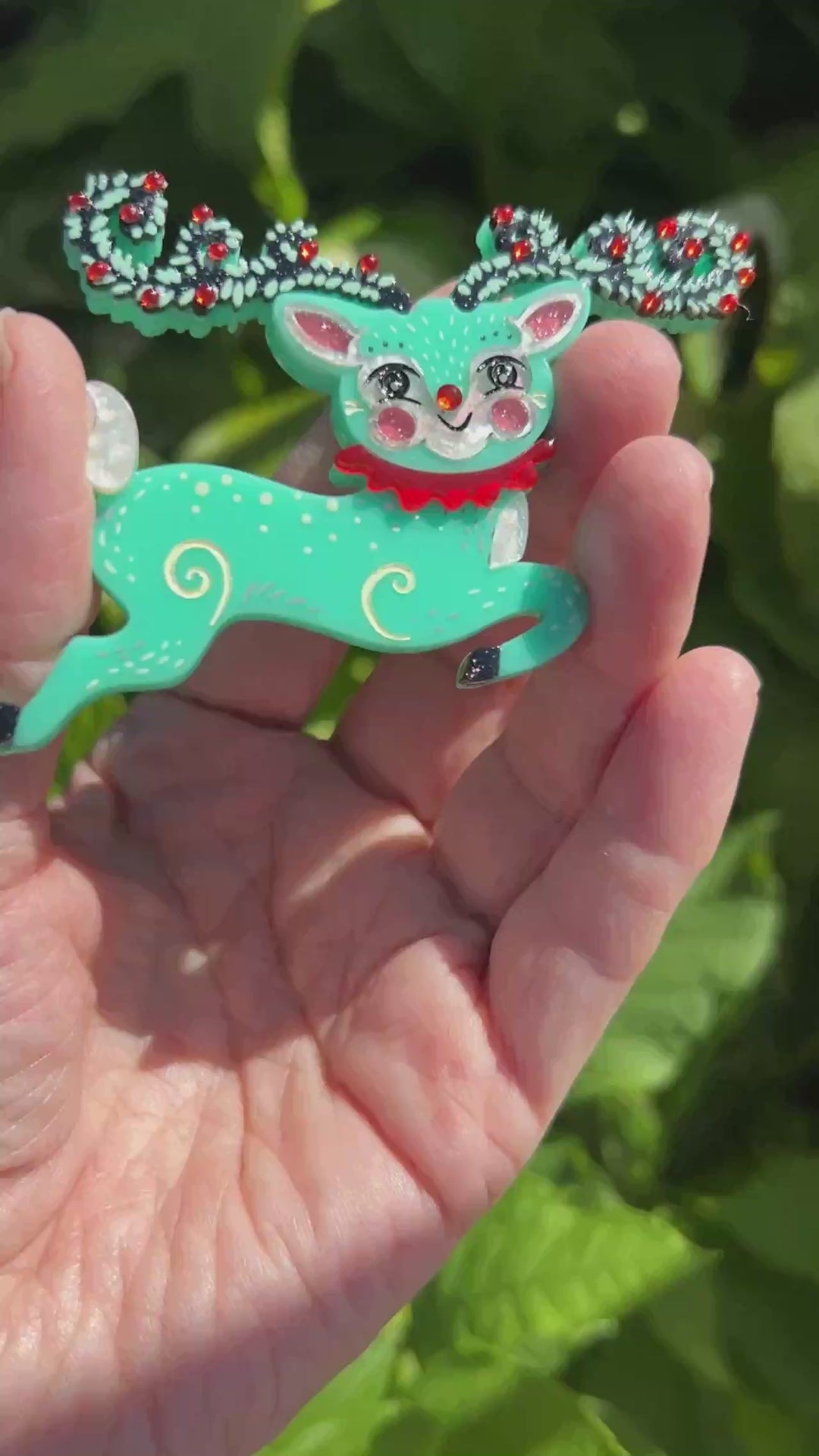 Video featuring the Fawna Fir Top Leaping Reindeer brooch by Johanna Parker and Lipstick & Chrome. Holiday deer pin.