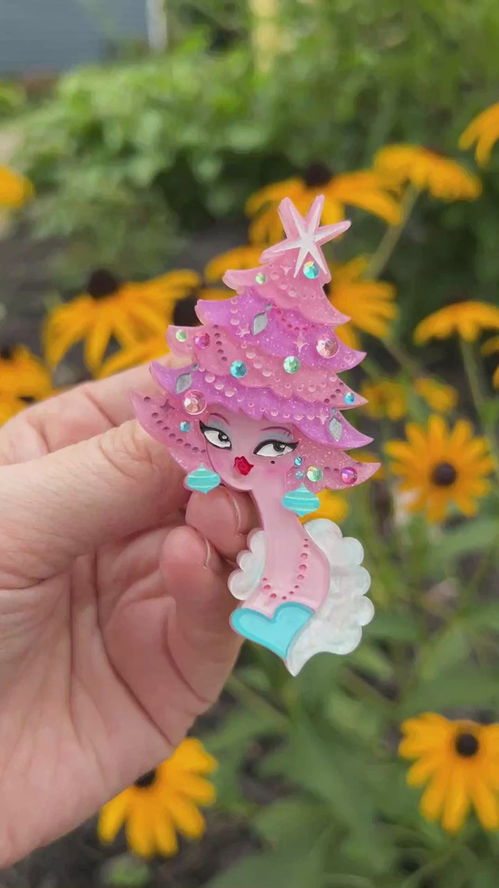 Video featuring the Pinkmas Glam Brooch by Miss Fluff and Lipstick and Chrome. Holiday pink Christmas tree pin.