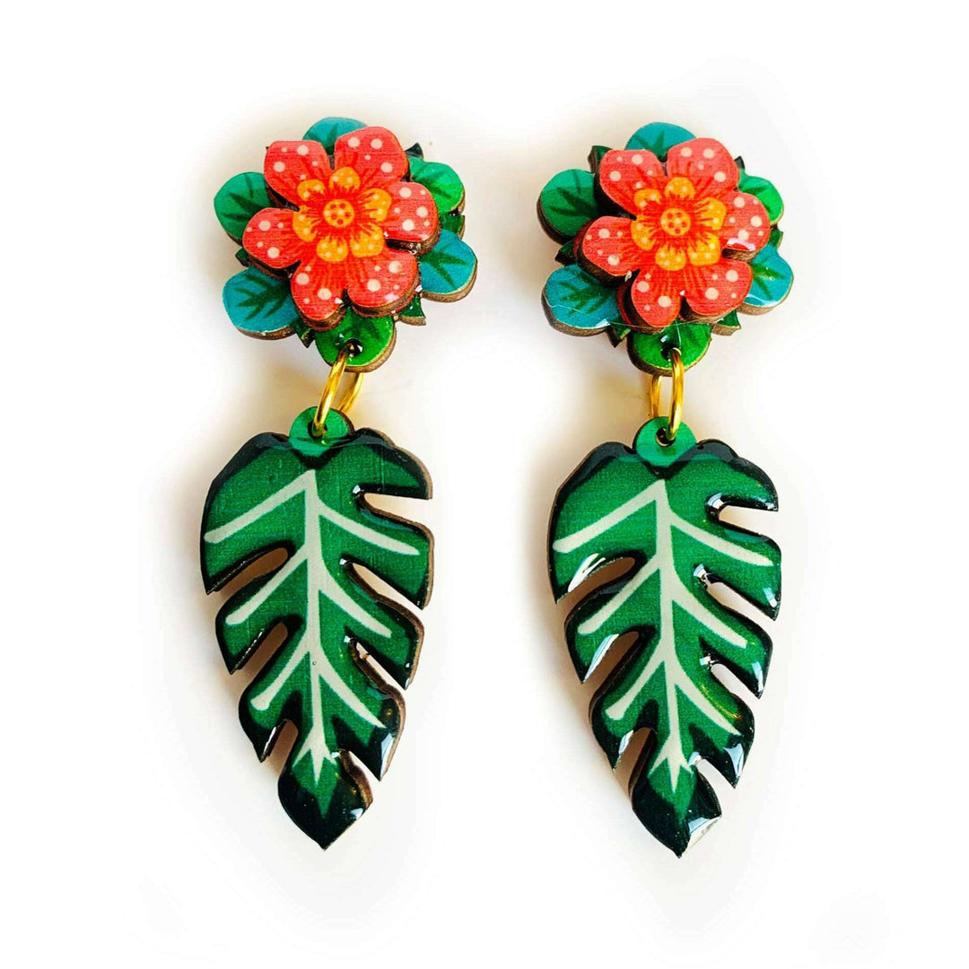 'Tropical flower leaf earrings' Check out these AMAZING tropical flower earrings - super funky pretty and very unusual. Created and illustrated inhouse with a glorious tropical 3D flower and drop leaf. You wont find another pair of earrings like these! Super for your summer style outfits! Earrings basics * Measurements - 6cm x 3cm * 3D Flower design. * Laser cut and finished with glass resin and pretty gem * Hypoallergenic back for safety and hygiene. * 100% handmade and designed. * Unusual design with a mi