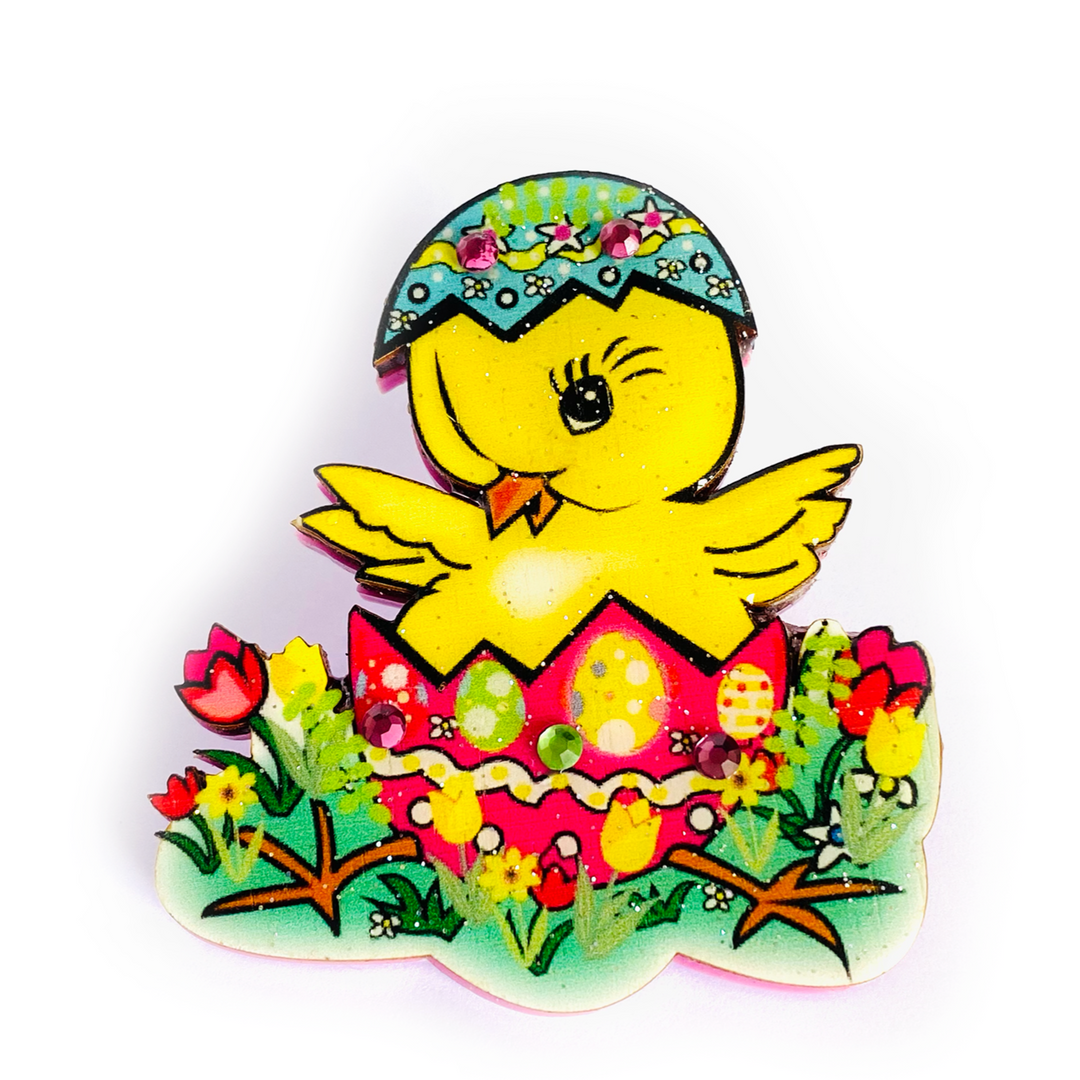<p>Little Benny the easter chic has just hatched ready for spring! He has all his friends and ready to eat his easter eggs! Yummy. Perfect little easter spring brooch for all you collectors out there. Brooch basics * measurements 6cm x 6cm * Certified woods/lasercut. * Stainless steel brooch back * Illustrated inhouse. * Resin cured. * Pastel acrylics. * Perfect for spring. * Bunny theme.. great easter gift!</p> <p>Benny the Easter Chic Brooch</p>