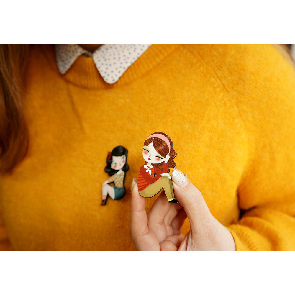 Puzzle with brunette girl brooch